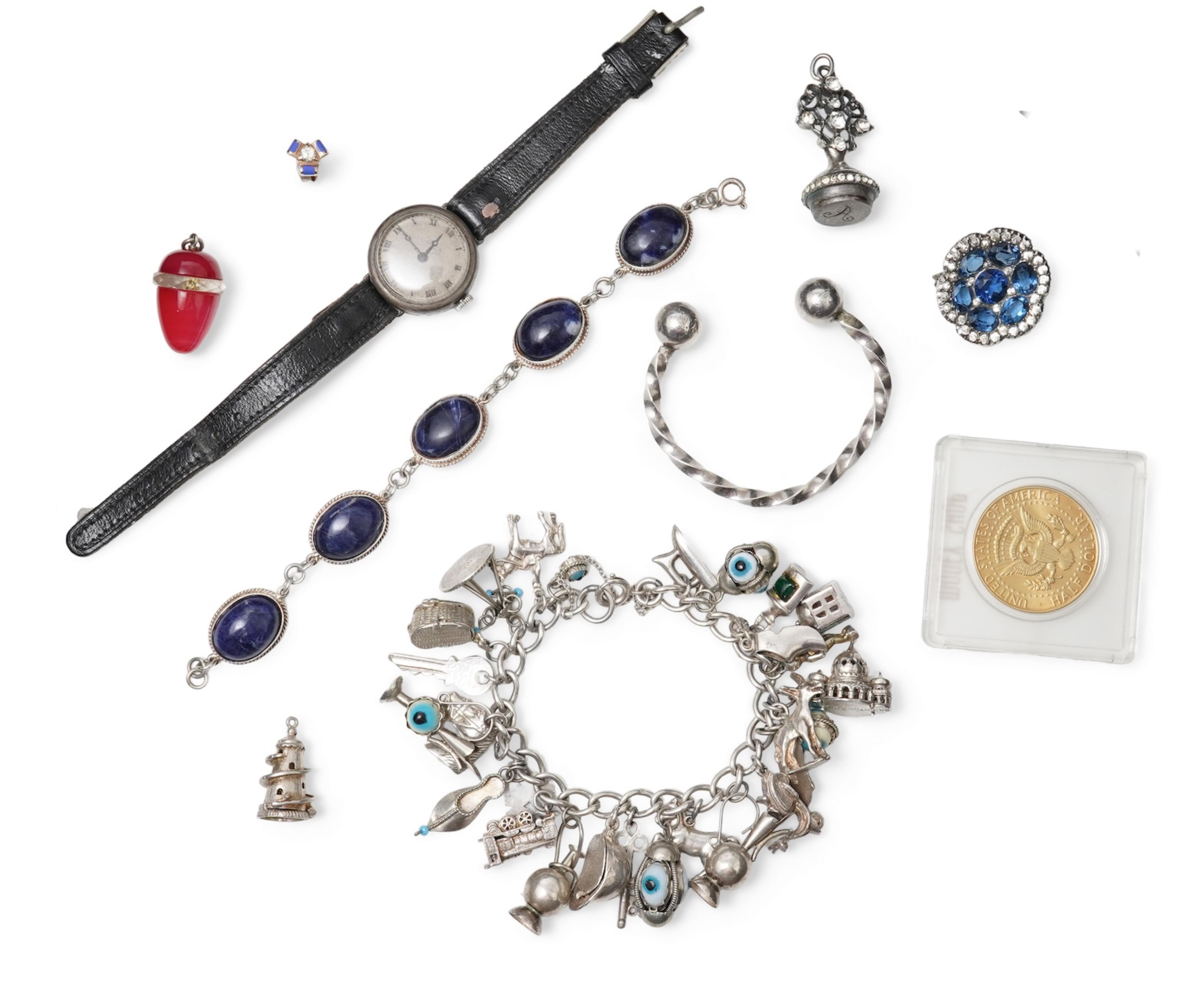 A collection of silver jewels, comprising: a single diamond stud earring weighing approximately 0.15 carats, accented with blue enamel; blue and colourless paste brooch of floral design, length 3.9cm; a dyed agate and fa